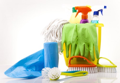 Cleaner wearing PPE during professional carpet cleaning in Bankside